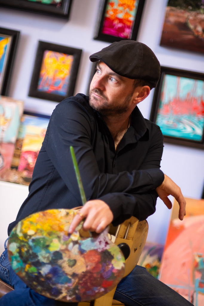 Drew Davis with artist palette